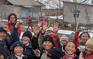 Richa Dhanju (left, rear) plays with a group of schoolchildren on her way to visit the remote village of Kung Elek in Kyrgyzstan.
