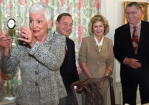 (From left) Ruth Siteman displays the Harris award as Chancellor Mark S. Wrighton, Ann Liberman, chair of the Harris award selection committee, and Alvin Siteman look on, during a recent ceremony at Harbison House. The Sitemans received the annual community-service award for their extraordinary service to the St. Louis region.