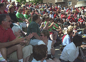 Hilltop Campus staff members sit in Bowles Plaza awaiting the results of several drawings for prizes.