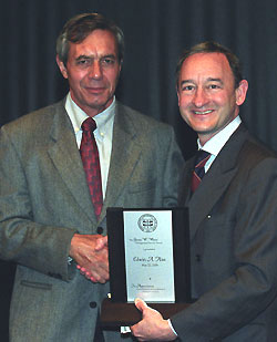 Above, Ed Hiss (left) receives a plaque from Chancellor Mark S. Wrighton, honoring the administrative officer in the Department of Chemistry in Arts & Sciences as winner of the Gloria W. White Distinguished Service Award. Hiss has worked in the chemistry department for 16 years.