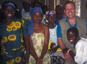 L. Lewis Wall, M.D., D.Phil., with fistula patients at Evangel Hospital, Jos, Nigeria. African women marry young, and many are unable to deliver their babies safely because their birth canals are not fully developed. During obstructed labor they may develop a fistula, an abnormal opening between the bladder and vagina that develops because their pelvis tissue has been crushed. Wall has traveled to Africa many times to perform surgery to repair the fistulas.