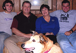 The Walls (from left), son Tom, Lewis, Helen, son Jimmy and family dog Sandy, relax in their Creve Coeur, Mo., home.