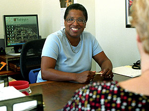 Leah Merrifield, special assistant to the chancellor for diversity initiatives, chats with Jill Edwards, project manager in the University's administrative offices.
