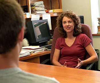 Tili Boon Cuillé, Ph.D. — pictured in her office — and her husband, Lionel Cuillé, Ph.D., both faculty in the Department of Romance Languages and Literatures in Arts & Sciences, enjoy living in Danforth House in the William Greenleaf Eliot Residential College.