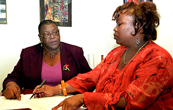 Virginia Toliver (left), associate dean of University Libraries, chats with Debora Spraggins, library business officer for Olin Library.