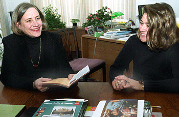 Priscilla Stone, Ph.D. (left), director of Overseas and Undergraduate Programs for International and Area Studies, chats in her office with assistant Toni Loomis.