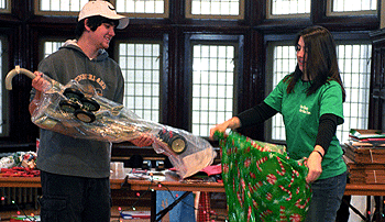 Freshman Jeremy Missuk and junior Ariel Wentworth, both in Arts & Sciences, help wrap donated items Nov. 11.