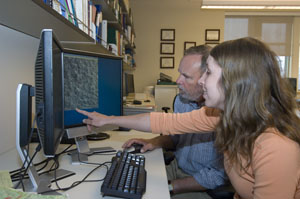 Tabatha Heet, a junior earth and planetary sciences major and Pathfinder student, shows Ray Arvidson, earth and planetary sciences department chair, a potential landing site for the Phoenix mission to Mars, set to launch in August.  Heet has played a majo