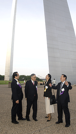 (From left) Lap-Chee Tsui, vice chancellor of the University of Hong Kong; Lau; Nami Kitamura, professor of energy sustainability at the University of Tokyo; and Binglin Gu, president of Tsinghua University, enjoy a view of the Gateway Arch prior to their tour of the facility May 5.