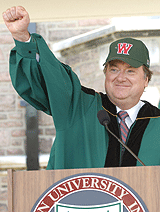 Tim Russert dons a WUSTL cap and exclaims,