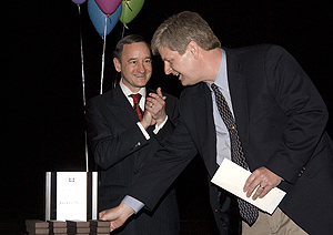 Chancellor Mark S. Wrighton applauds John