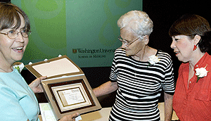 (From left) Rosemary J. Lueck, Marge Boyd and Linda Susan Day admire Lueck's certificate for 41 years of service to the University at the First Annual Length of University Service award programs June 4 at the Eric P. Newman Education Center. Lueck works for the Washington University Physician Billing Service. Boyd was recognized for 53 years of service to the Division of Gynecological Oncology, and Day, who works in the Department of Radiology, was recognized for 40 years of service.