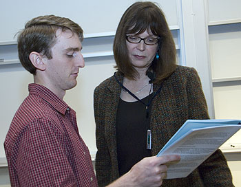 Erika Crouch, M.D., Ph.D., professor of pathology and immunology, talks about lung disease with Aaron McAllister, a second-year medical student, after class. 