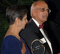 Former dean Shanti K. Khinduka, Ph.D., receives the