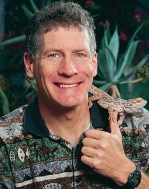 Professor Losos displays lab mascot, Morton, an Australian-bearded dragon.