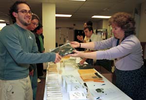 Senior Zachary Asher picks up his cap and gown