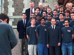 Members of University administration stand with the group