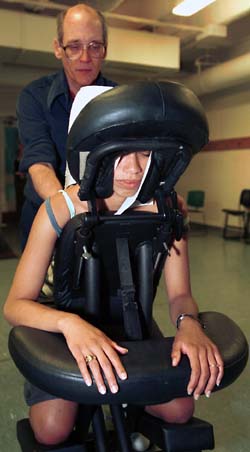 Patrick Morris works on the shoulders of Paola Rijos