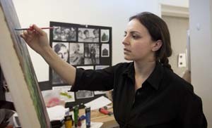 The multitalented Sklobovskaya paints in her studio. “Natalie is a dedicated, introspective person with a unique gift of communicating her many varied talents, from animation, illustration, web design, computer programming, and music, in innovative ways,” says Cris Baldwin, assistant dean and registrar for the College & Graduate School of Art.