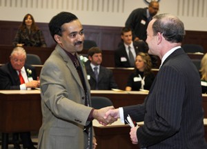 Chancellor Mark S. Wrighton (right) greets Seethu Seetharaman, PhD, at the start of the ceremony installing him as the W. Patrick McGinnis Professor of Marketing at Olin Business School.