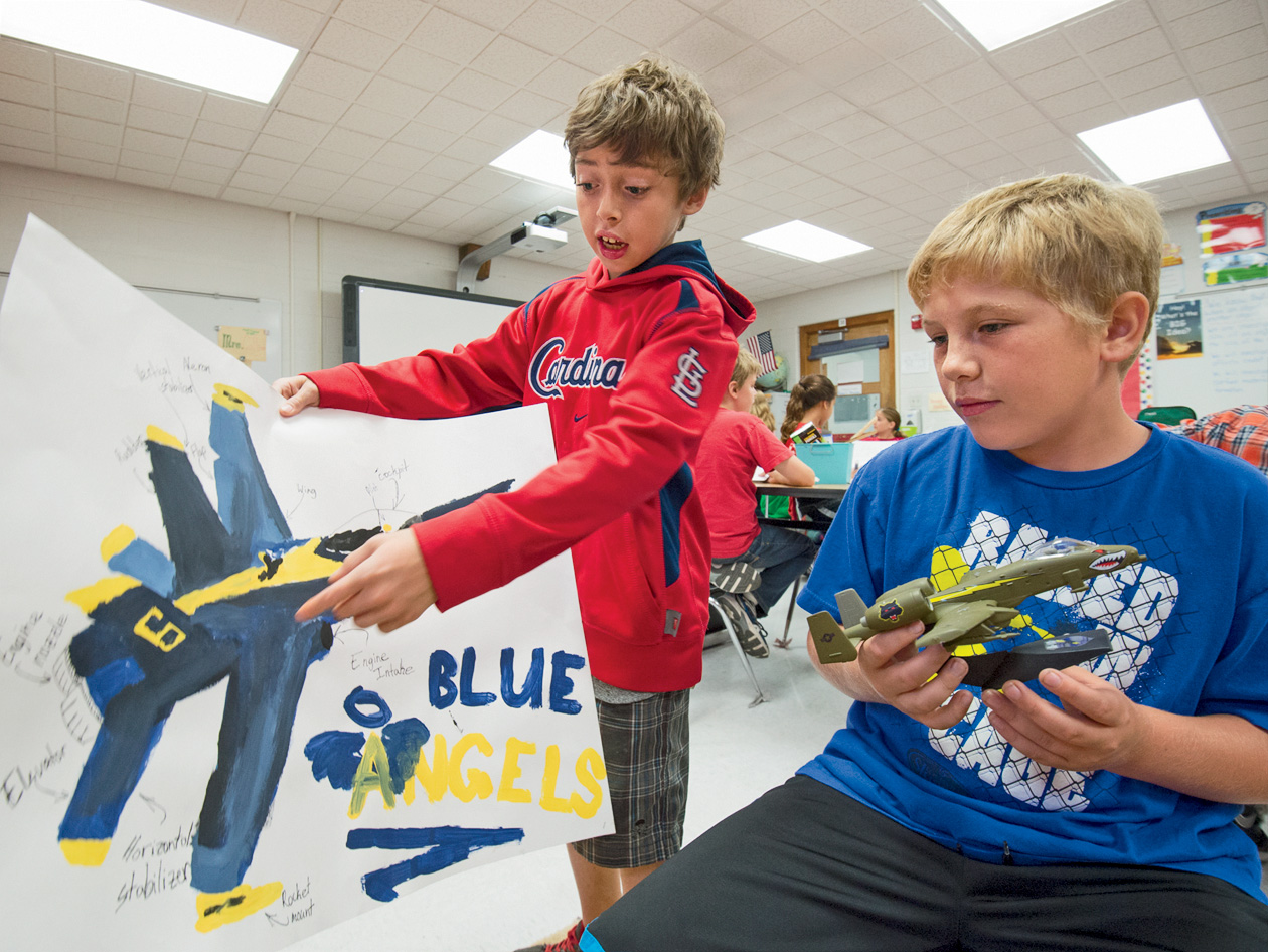 Georgene Collier’s 5th-grade class in the Hazelwood School District shows off their individual portfolio projects. Zach Gonzalez (left) and Dakota Fort chose aviation as their portfolio project. Zach, whose father is a pilot, drew a "Blue Angels" F/A-18 Hornet and Dakota built an A-10 Warthog used mainly to hurt and destroy tanks and heavy machinery. (Photo: Joe Angeles)