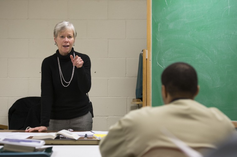 A teacher addresses her class.