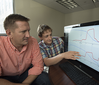 Brian N. Finck, PhD (left), and Kyle S. McCommis, PhD, analyze data showing it's possible to reduce blood sugar levels in people with diabetes by lowering glucose production in the liver. 