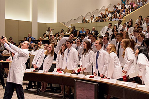 Medical students receive white coats, take oath