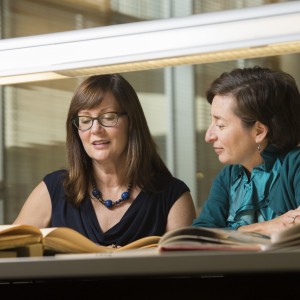 Rebecca Messbarger (left) and Corinna Treitel in the Kenneth and Nancy Kranzberg Art & Architecture Library.