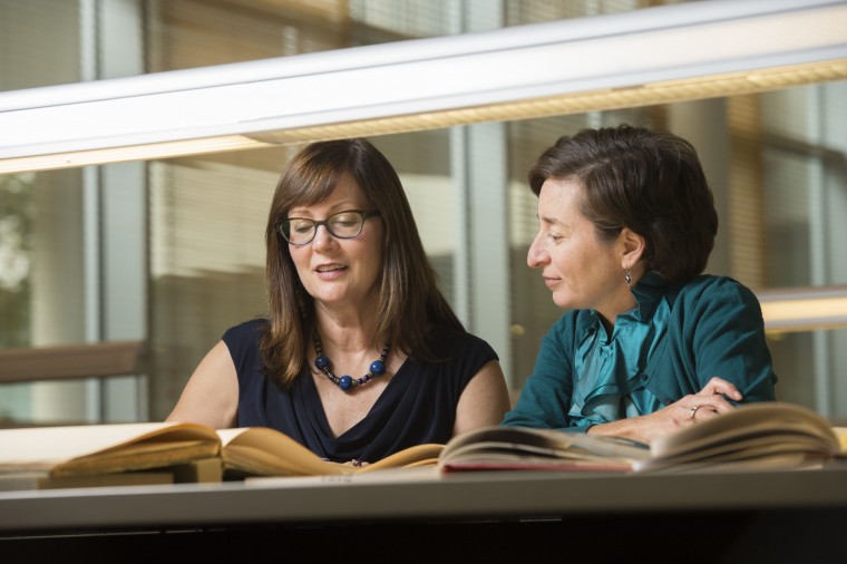 Rebecca Messbarger (left) and Corinna Treitel in the Kenneth and Nancy Kranzberg Art & Architecture Library.