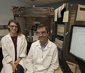 Washington University School of Medicine researchers Courtney Sobieski (left) and Steven Mennerick, PhD, found, in culture, that without cells called astrocytes, neurons send signals to one another more slowly. That slowdown could interfere with neuronal development and contribute to conditions linked to communication between neurons. (Photo: Robert Boston)