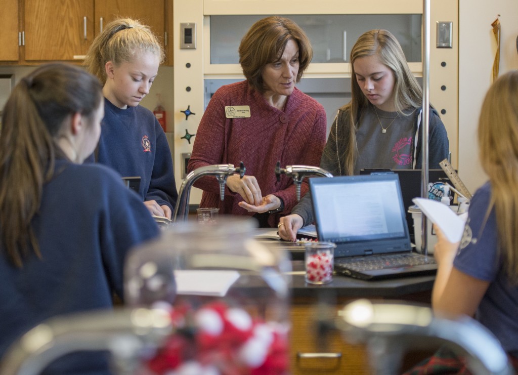 Heather Essig leads a high school science experiment