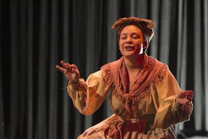 Woman on stage, eyes closed