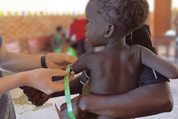 A child being examined by a doctor.