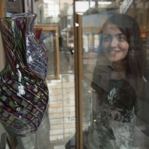 girl looking at vase