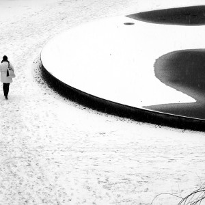 woman walks through snow