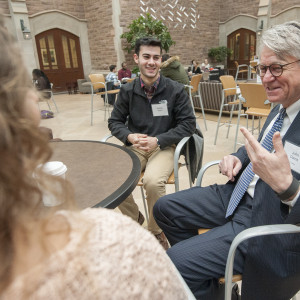 people chat at a table