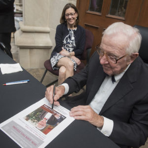 John Paul Stevens signing paper