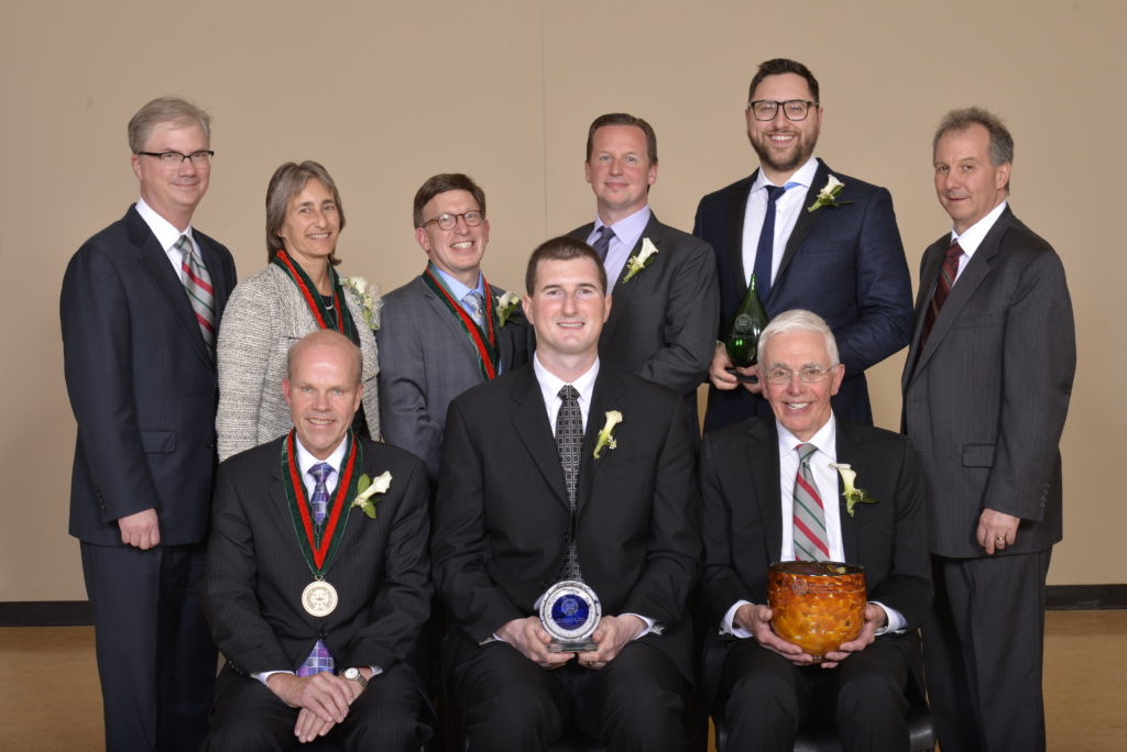 Back row (from left): Provost Holden Thorp, Anna Apanel, Steve Kramer, Chris Sims, David Karandish, Dean Aaron Bobick. Front row (seated, from left): Alex Gray, John Zook, former dean Ralph Quatrano