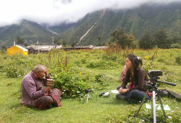 Jhangchuk Sangmo, a researcher from the Nubri region of Nepal, interviews an elderly nun about the aftermath of a 2015 earthquake.