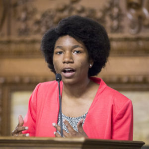 student speaks at microphone