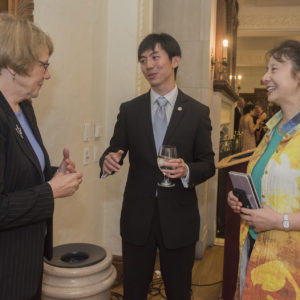 people chat at a reception