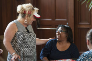 women smile at a bingo game