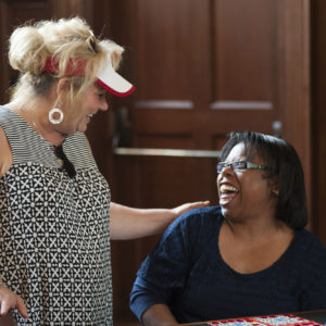 women smile at a bingo game