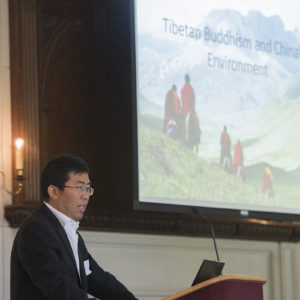 man talking at podium