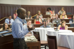 man speaks to conference