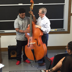 student and professor at music lesson