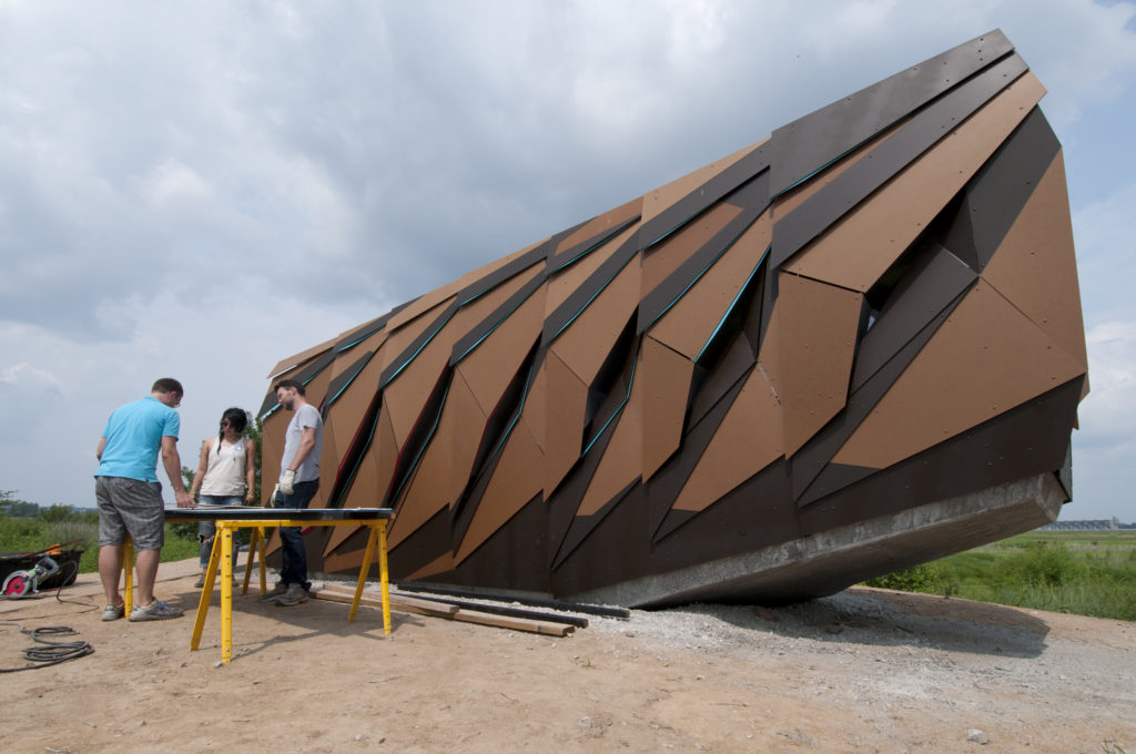 Students and faculty designed and constructed this avian observatory for the Audubon Center at Riverlands in West Alton, near the confluence of the Mississippi and Missouri. Pictured from left to right are Andrew Colopy, Erin Chen and James Struthers. (Photo: Danny Reise/Washington University)