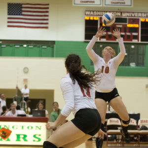 player hits volleyball