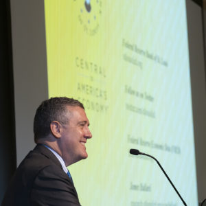 man stands in front of podium